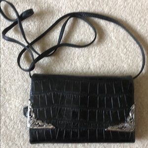Crossbody wallet purse with silver corners.